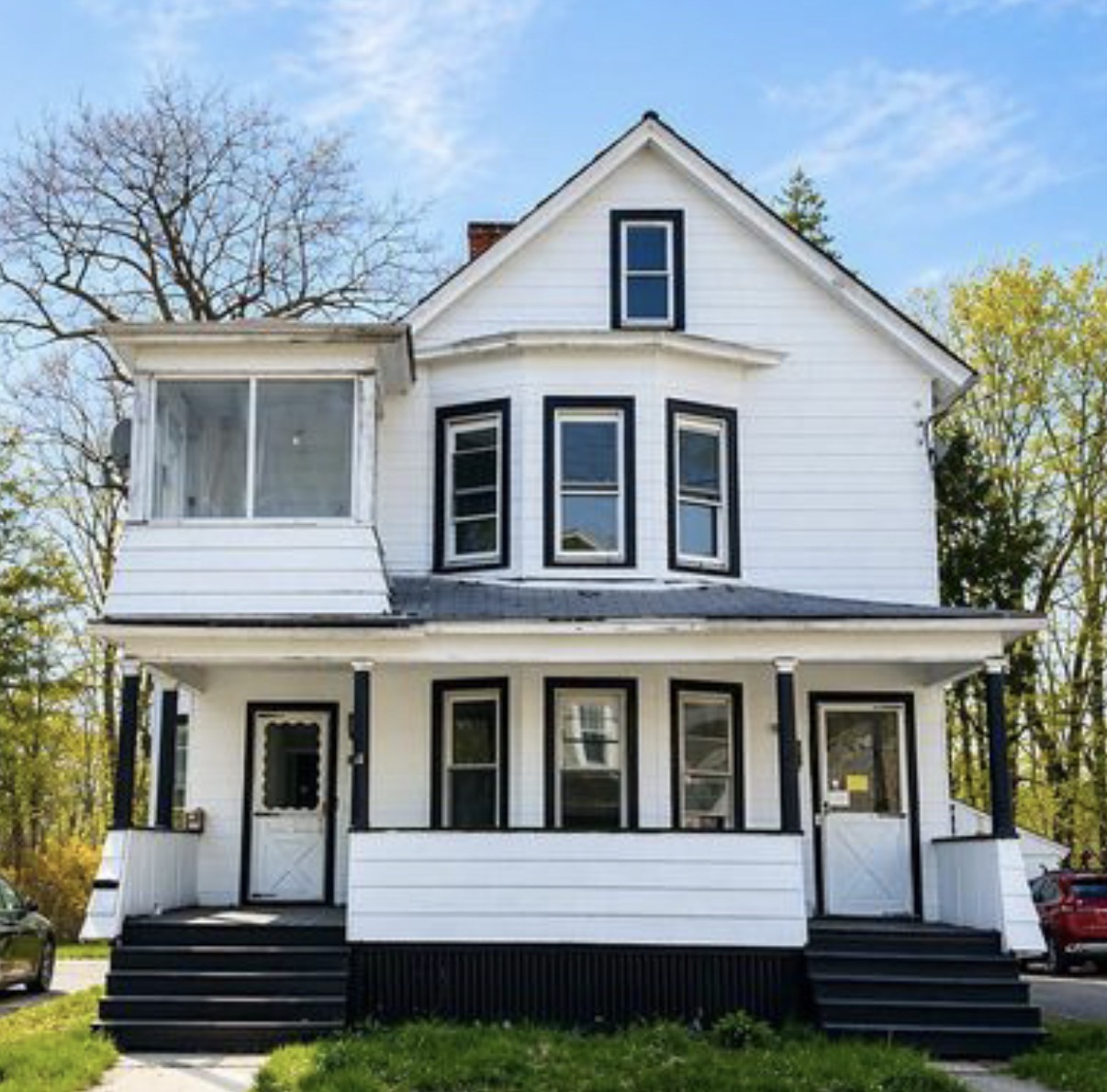 Two-story fix and flip investment property with front porch funded in Amsterdam, NY